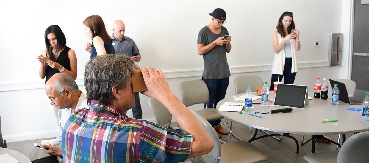 Man using Google Cardboard headset