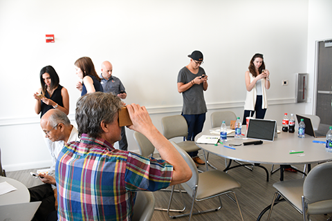 Man using Google Cardboard headset